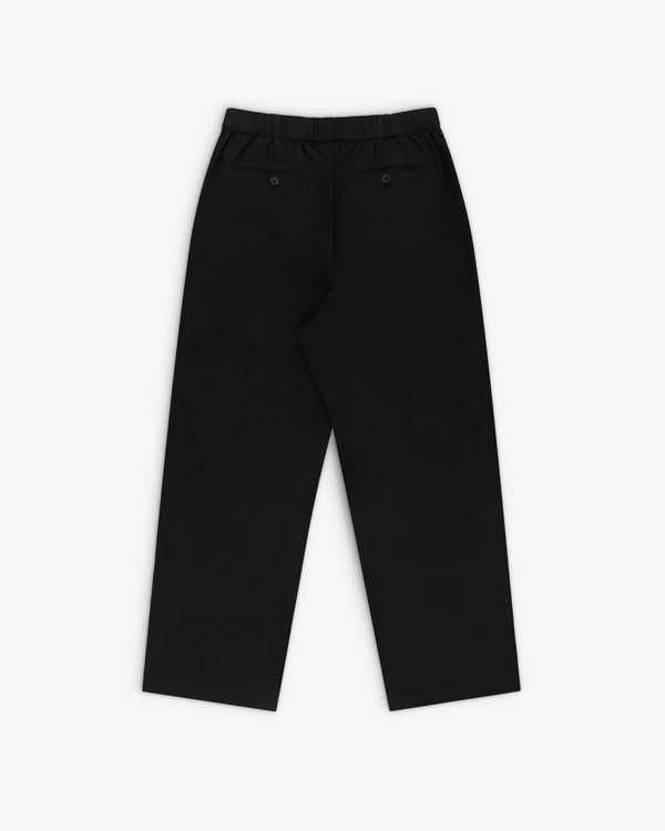 The Relaxed Cotton Trouser features a straight-leg fit, elastic waistband, and two buttoned back pockets, back view shown.