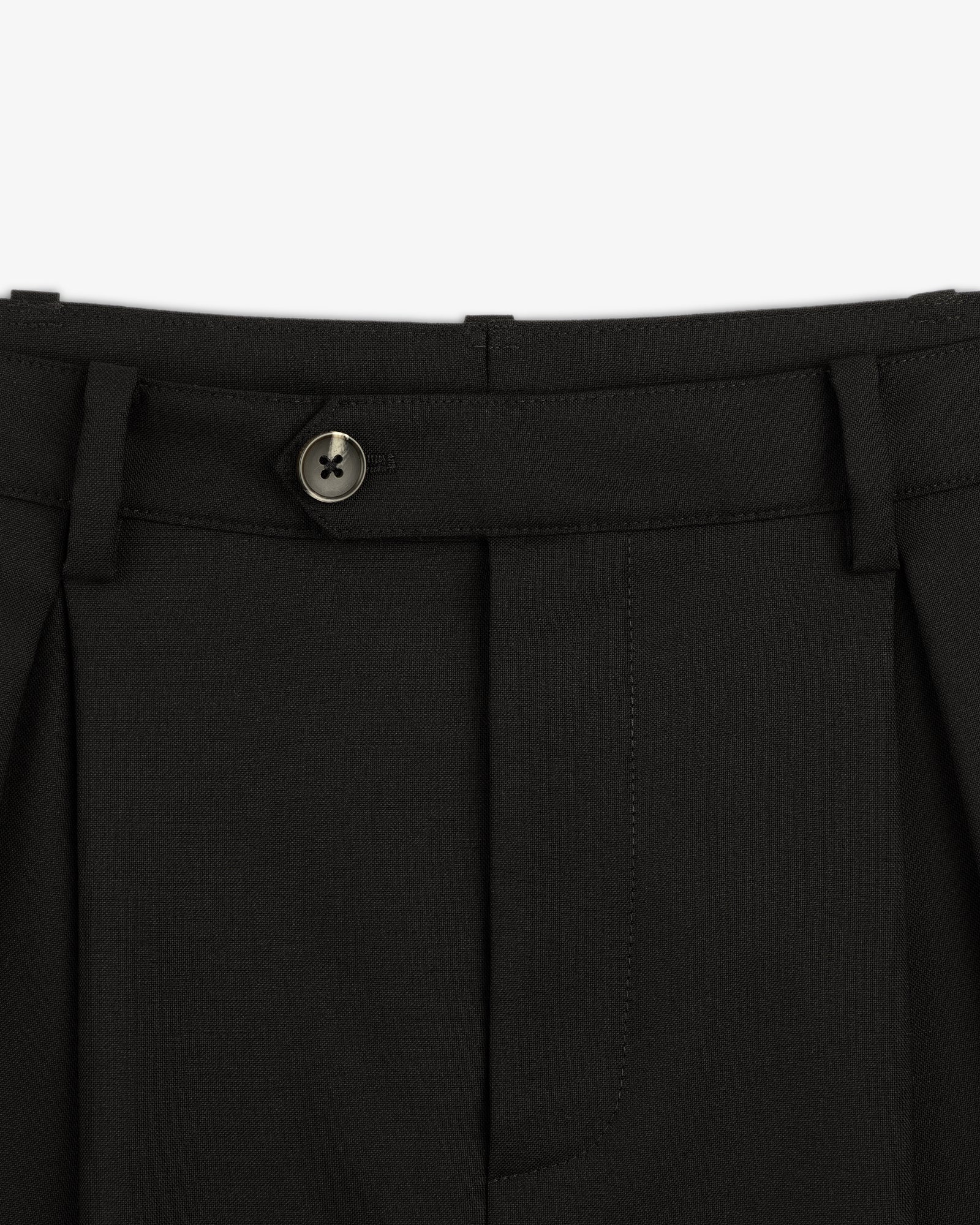 Close-up of the waistband and button on Lightweight Cuffed Trouser, featuring belt loops and pleated fabric.