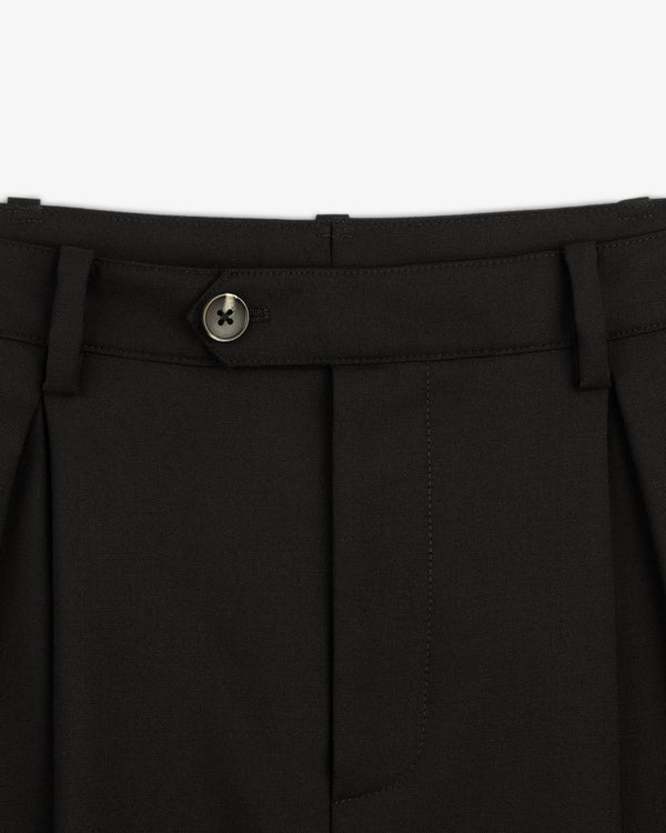 Close-up of the waistband and button on Lightweight Cuffed Trouser, featuring belt loops and pleated fabric.