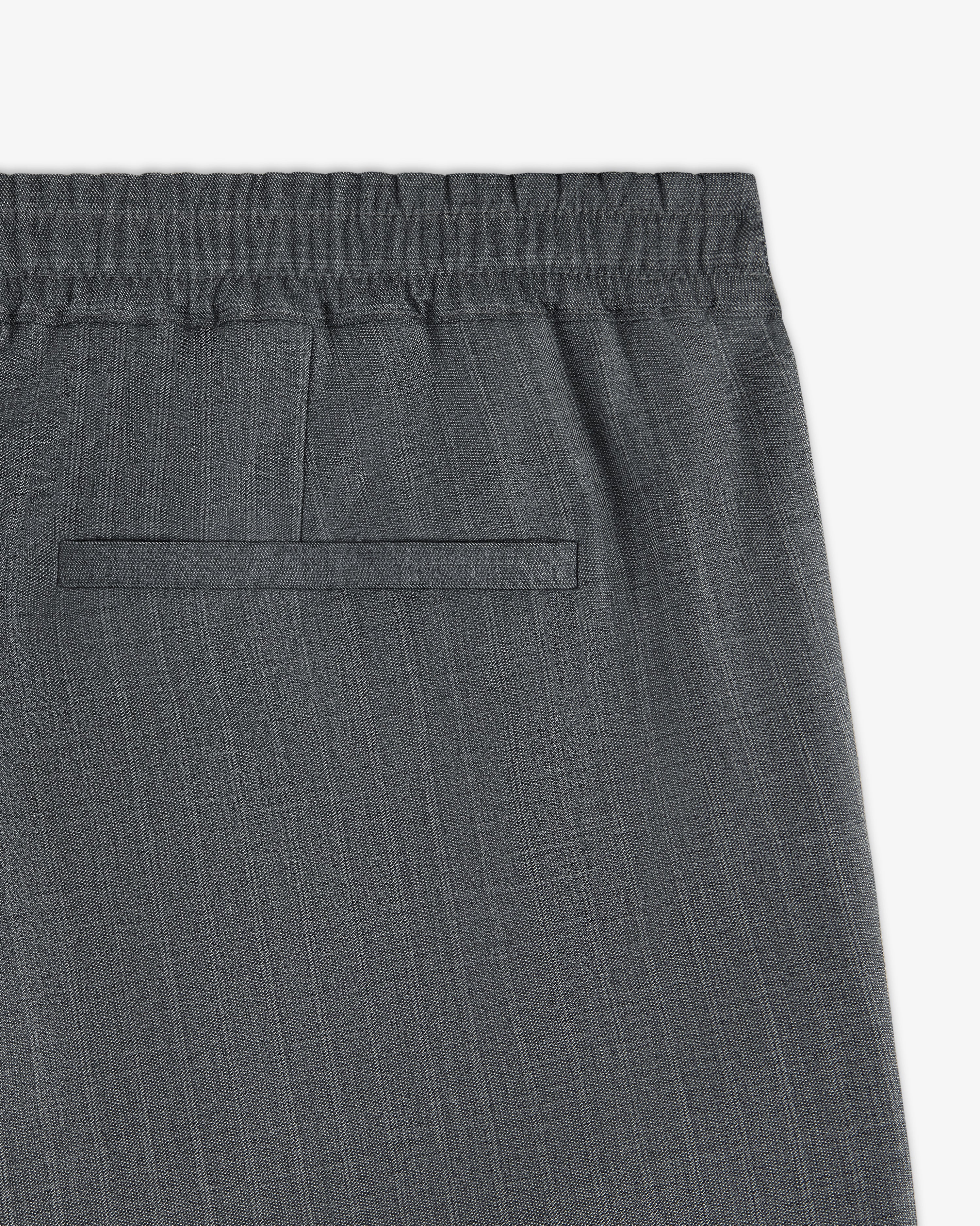 Close-up of Pinstripe Elasticated Waist Trouser in grey, featuring a single back welt pocket.