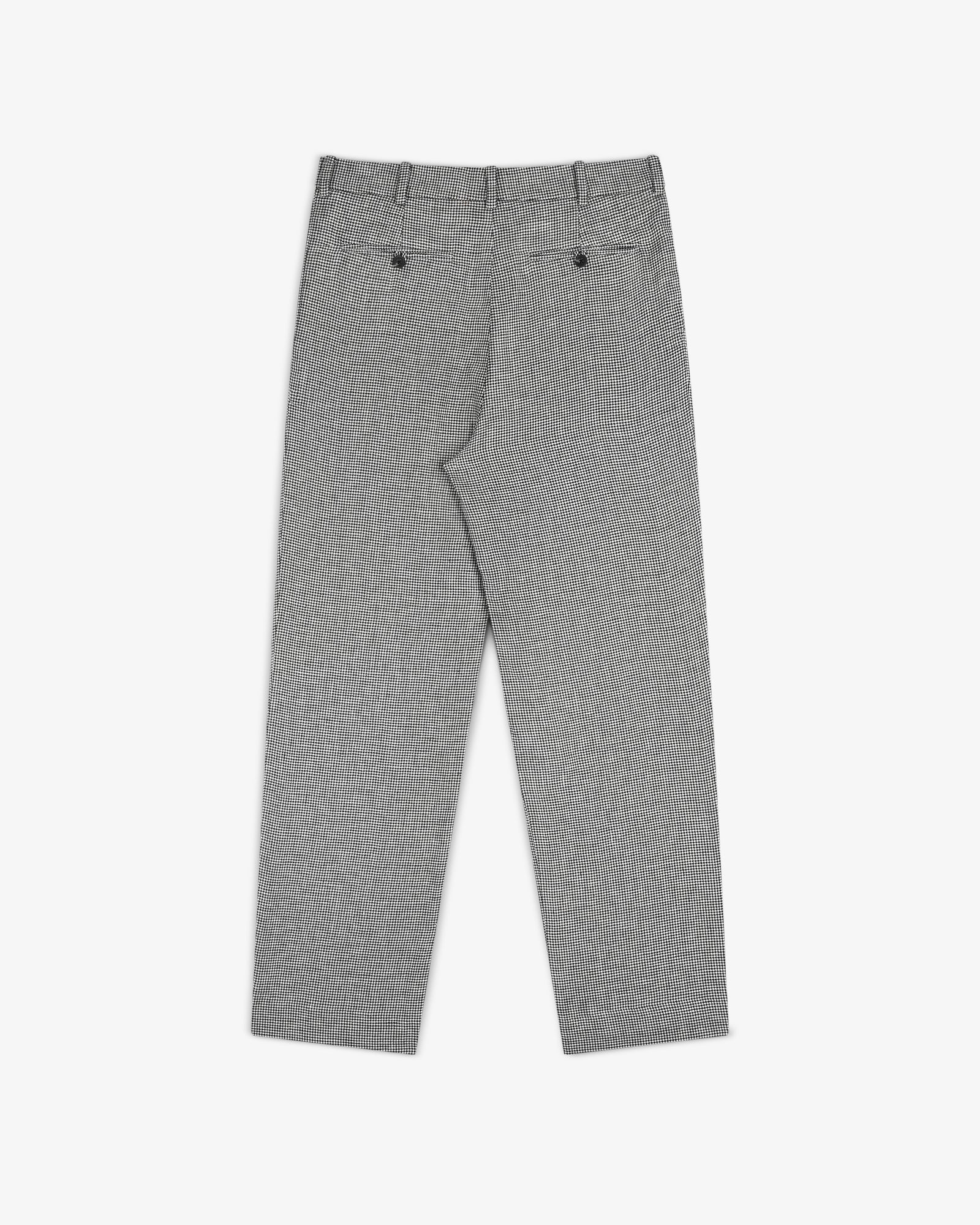 Houndstooth Pleated Trouser shown from the back with belt loops and two buttoned back pockets, laid flat on white.