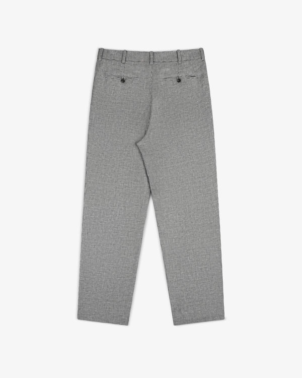 Houndstooth Pleated Trouser shown from the back with belt loops and two buttoned back pockets, laid flat on white.