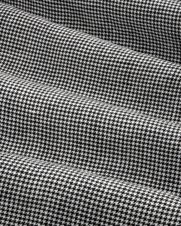 Black and white houndstooth Pleated Trouser with gentle folds and a soft, textured appearance.