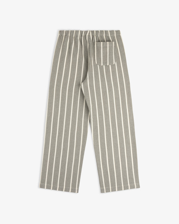 Wide Leg Shore Pant in gray with vertical white stripes, elastic waistband, and single back pocket, shown flat.