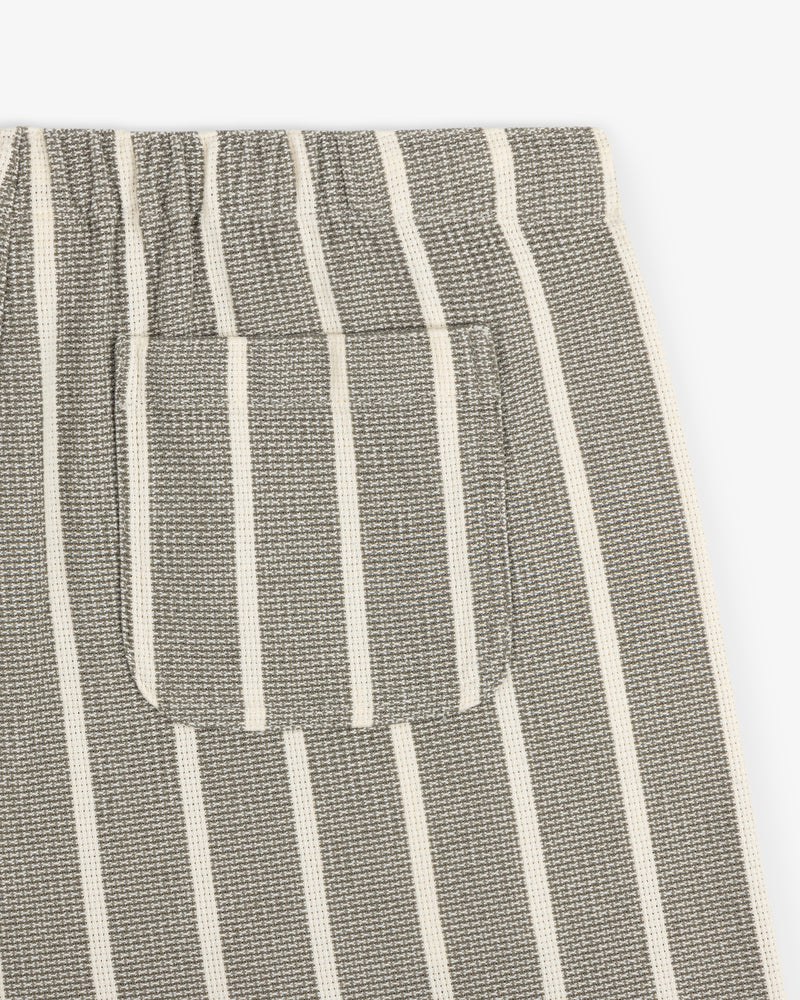 Close-up of the Wide Leg Shore Pant in gray with white vertical stripes and a small matching striped front pocket.