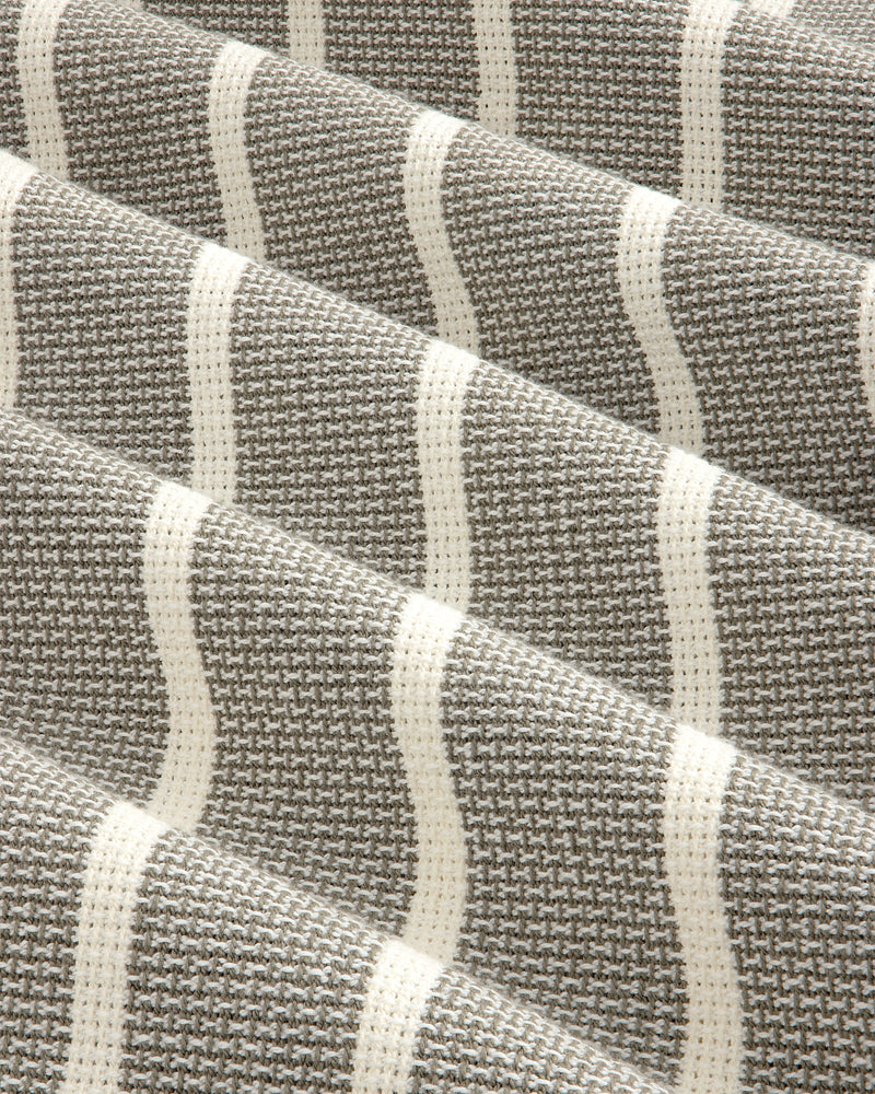 Close-up of Wide Leg Shore Pant in gray and white houndstooth with cream horizontal stripes and textured weave.