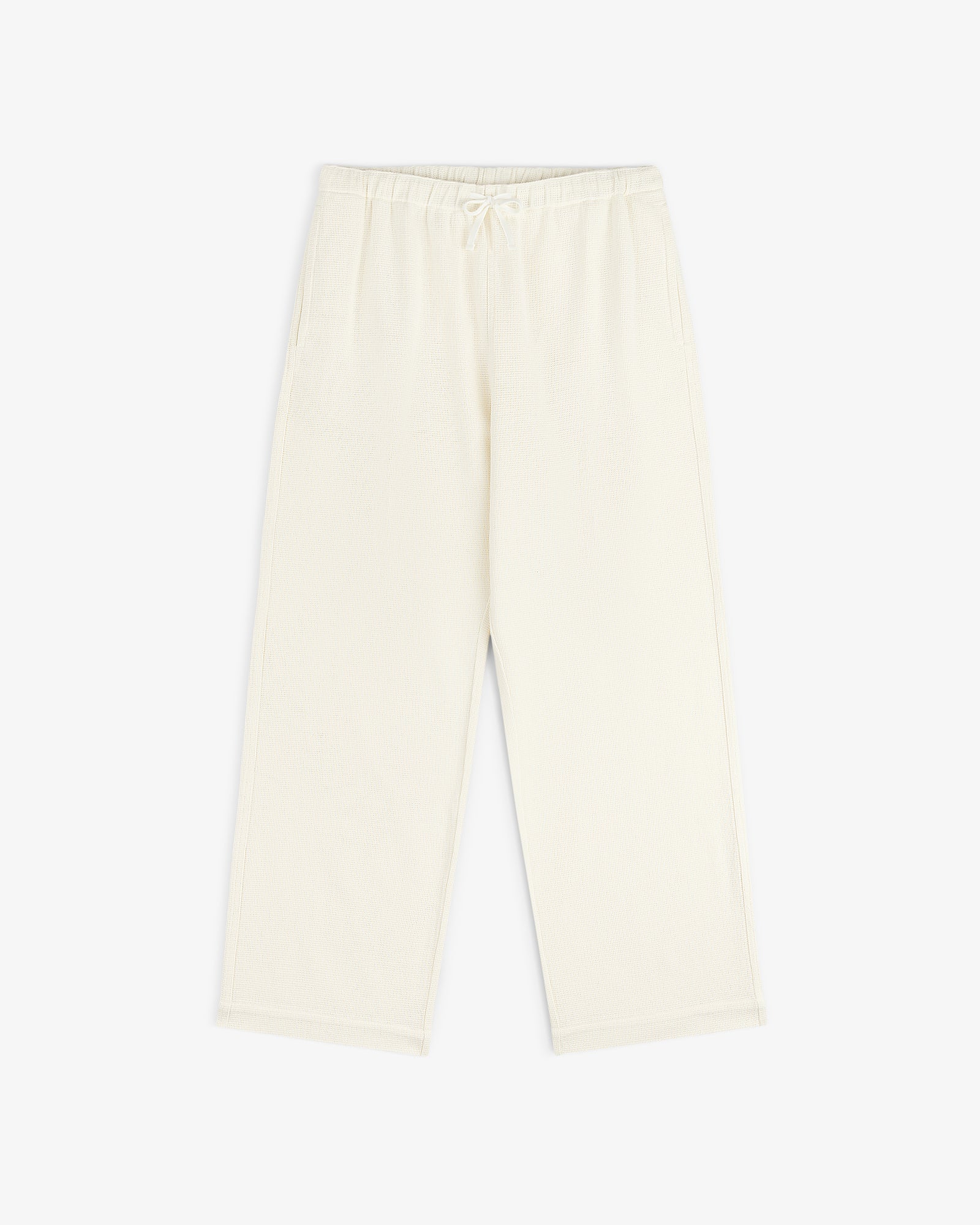 Cream Wide Leg Shore Pant with elastic waistband and side pockets, shown laid flat on a white background.