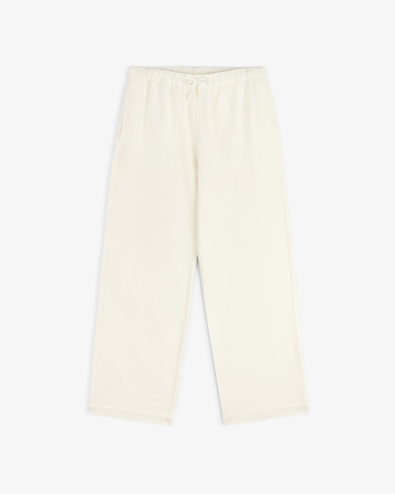 Cream Wide Leg Shore Pant with elastic waistband and side pockets, shown laid flat on a white background.