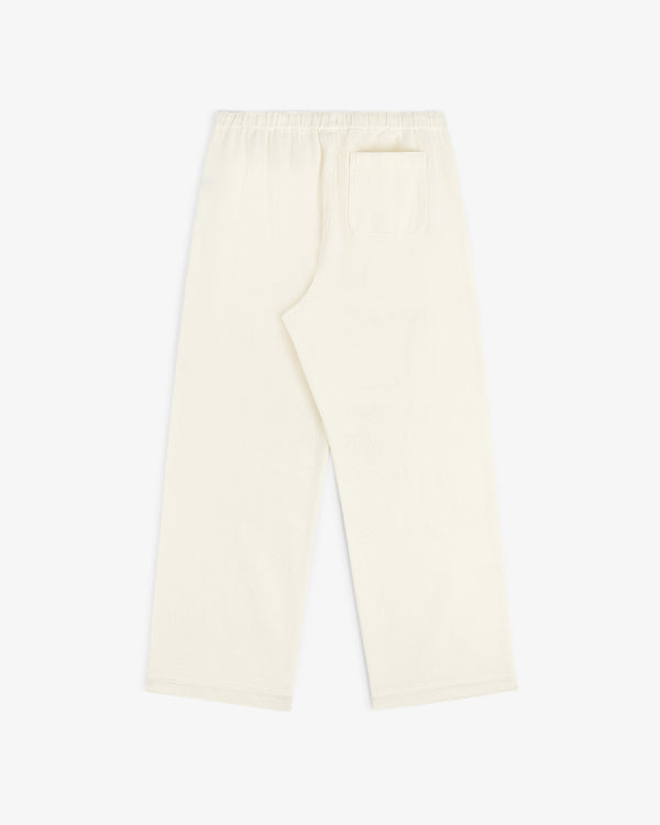 Cream-colored Wide Leg Shore Pant with an elastic waistband and back pocket, shown flat on a white background.