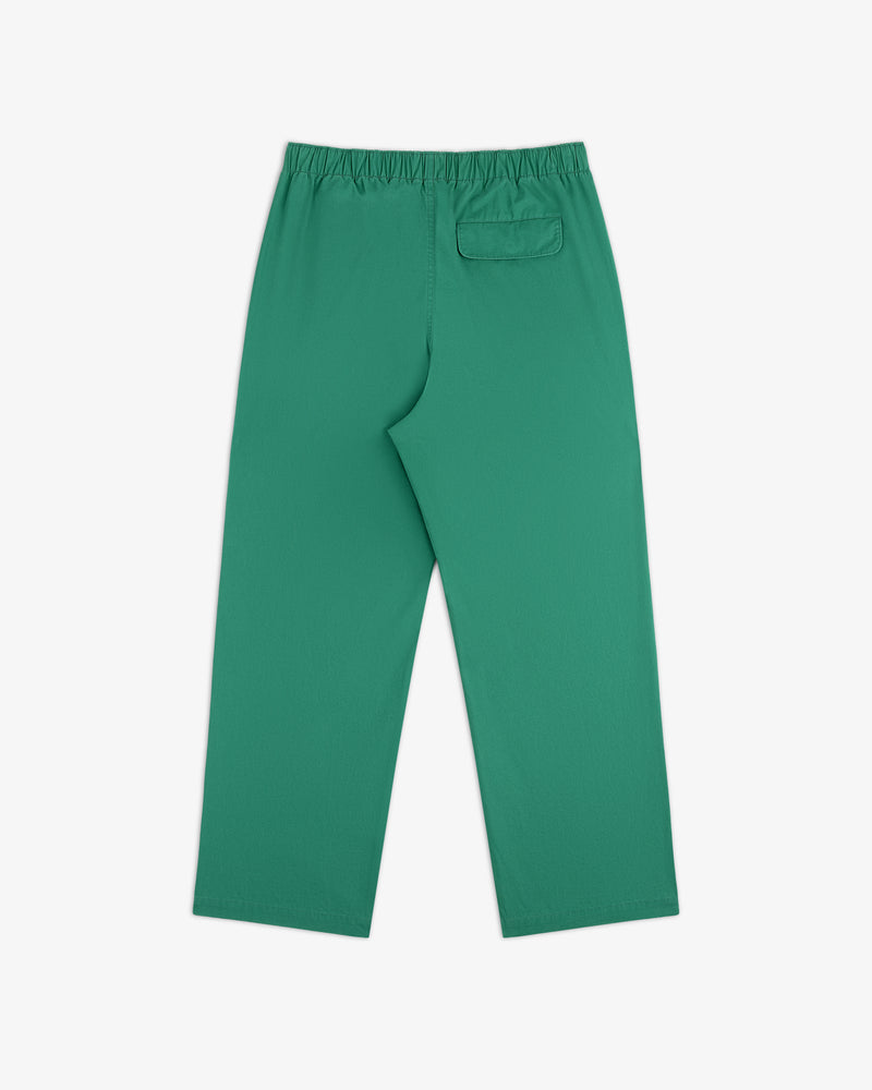 Washed Cotton Windbreaker Pant in green with an elastic waistband and a back pocket, shown flat on white background.