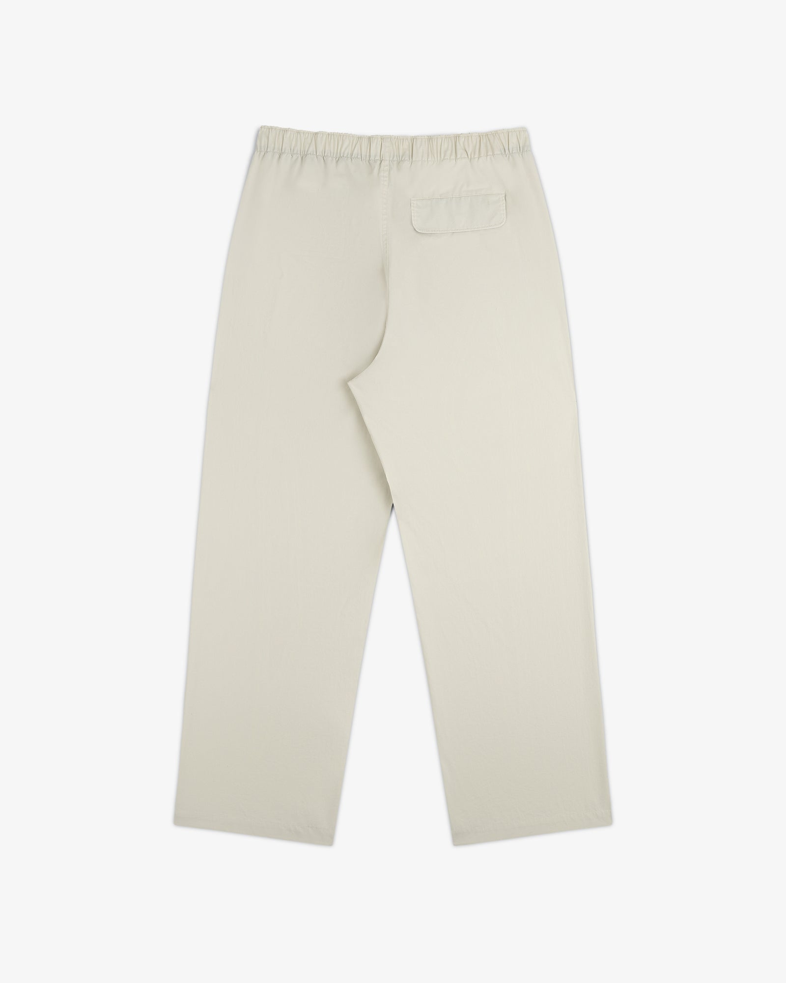 Washed Cotton Windbreaker Pant in beige, straight-leg with elastic waistband and single back pocket, shown flat.
