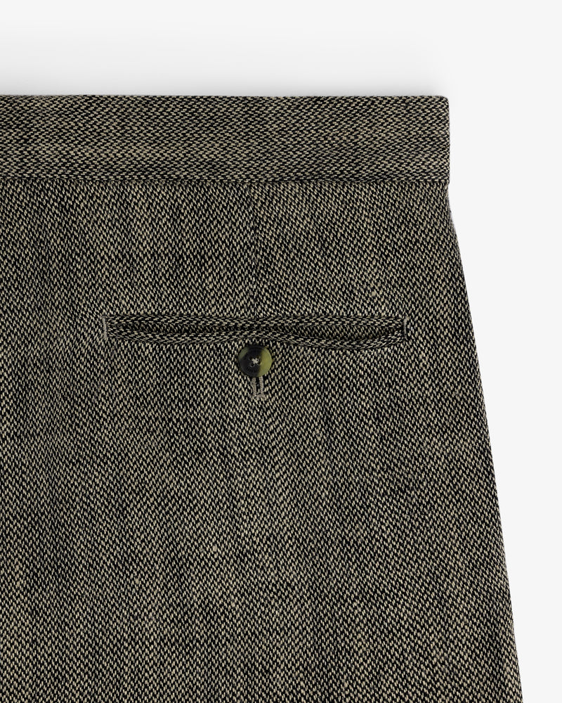 Close-up of the back pocket on Yarn Dyed Linen Suit Trouser in gray with a single button closure.