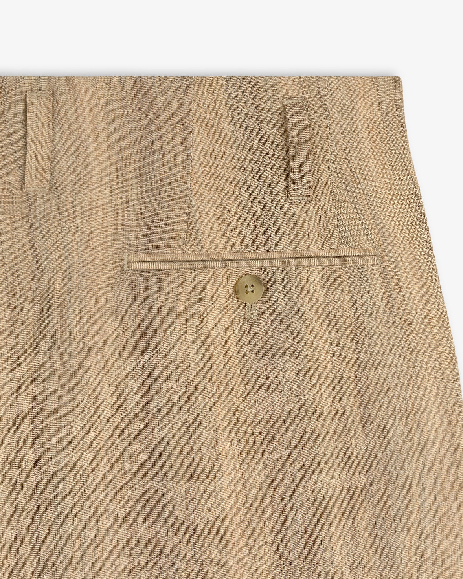 Close-up of Double Pleated Safari Suit Trouser in beige, highlighting the back pocket with button and two belt loops.