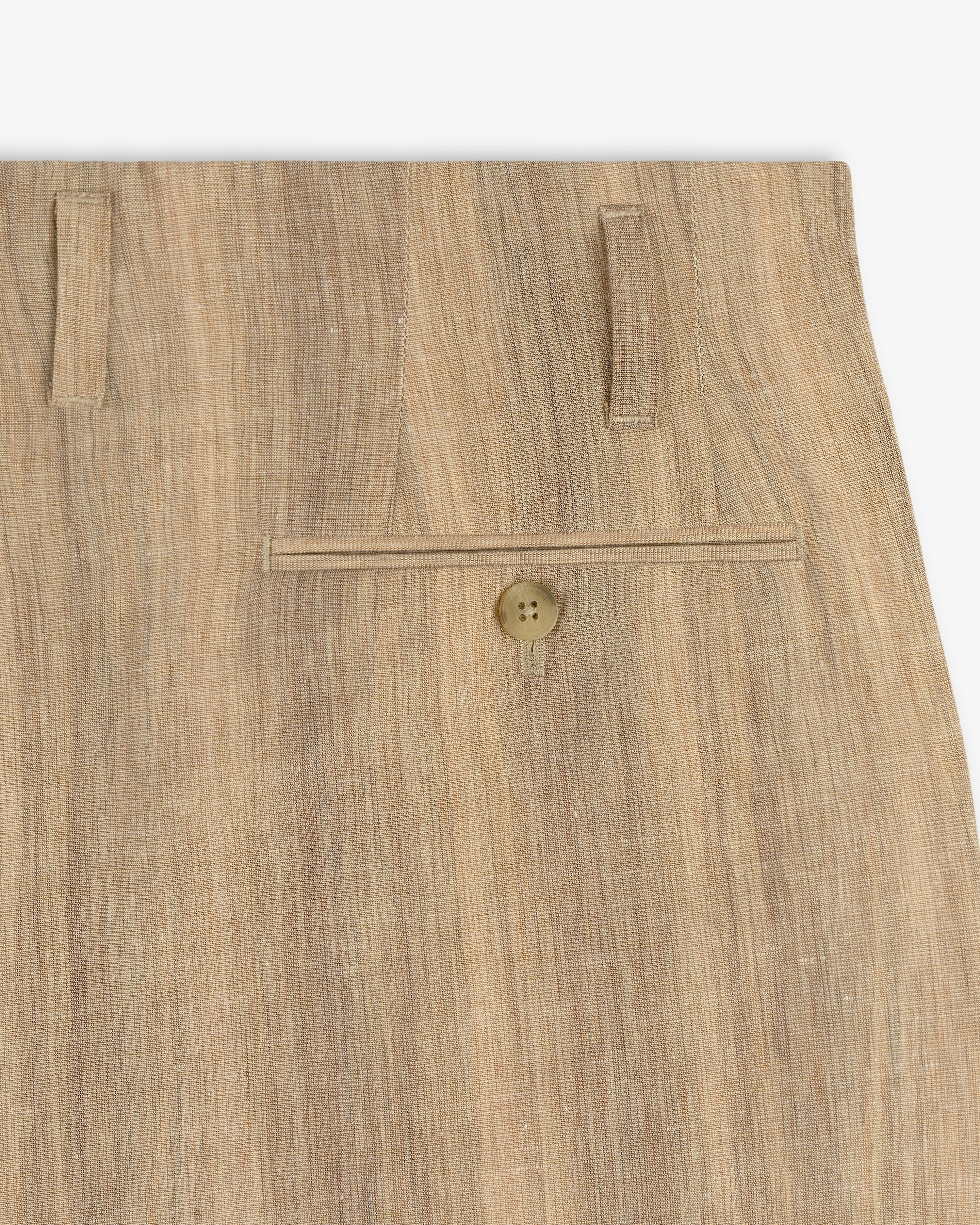 Close-up of Double Pleated Safari Suit Trouser in beige, highlighting the back pocket with button and two belt loops.