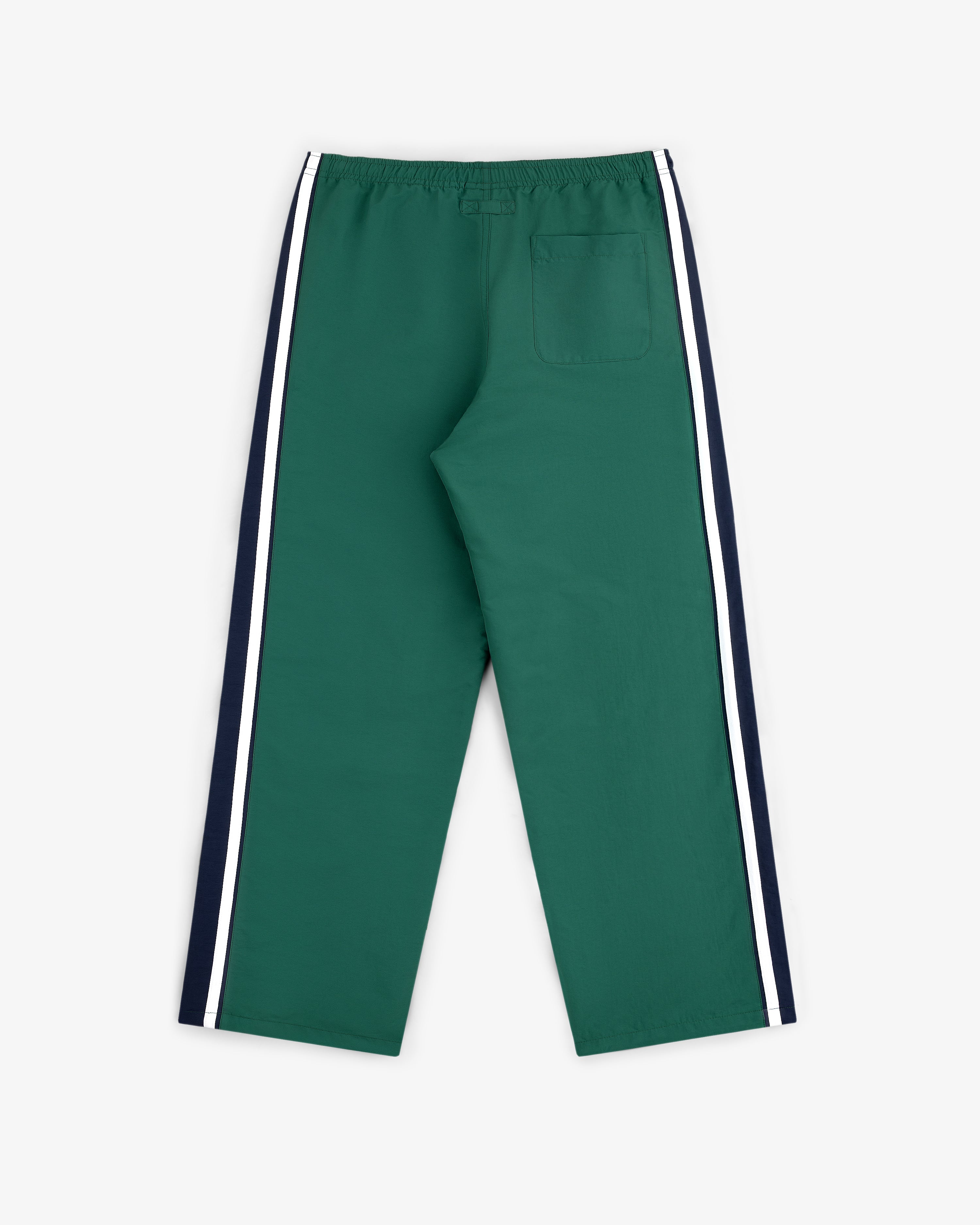 Colorblock Track Pant in green with white/navy side stripes, elastic waist, and single back pocket, shown flat on white.