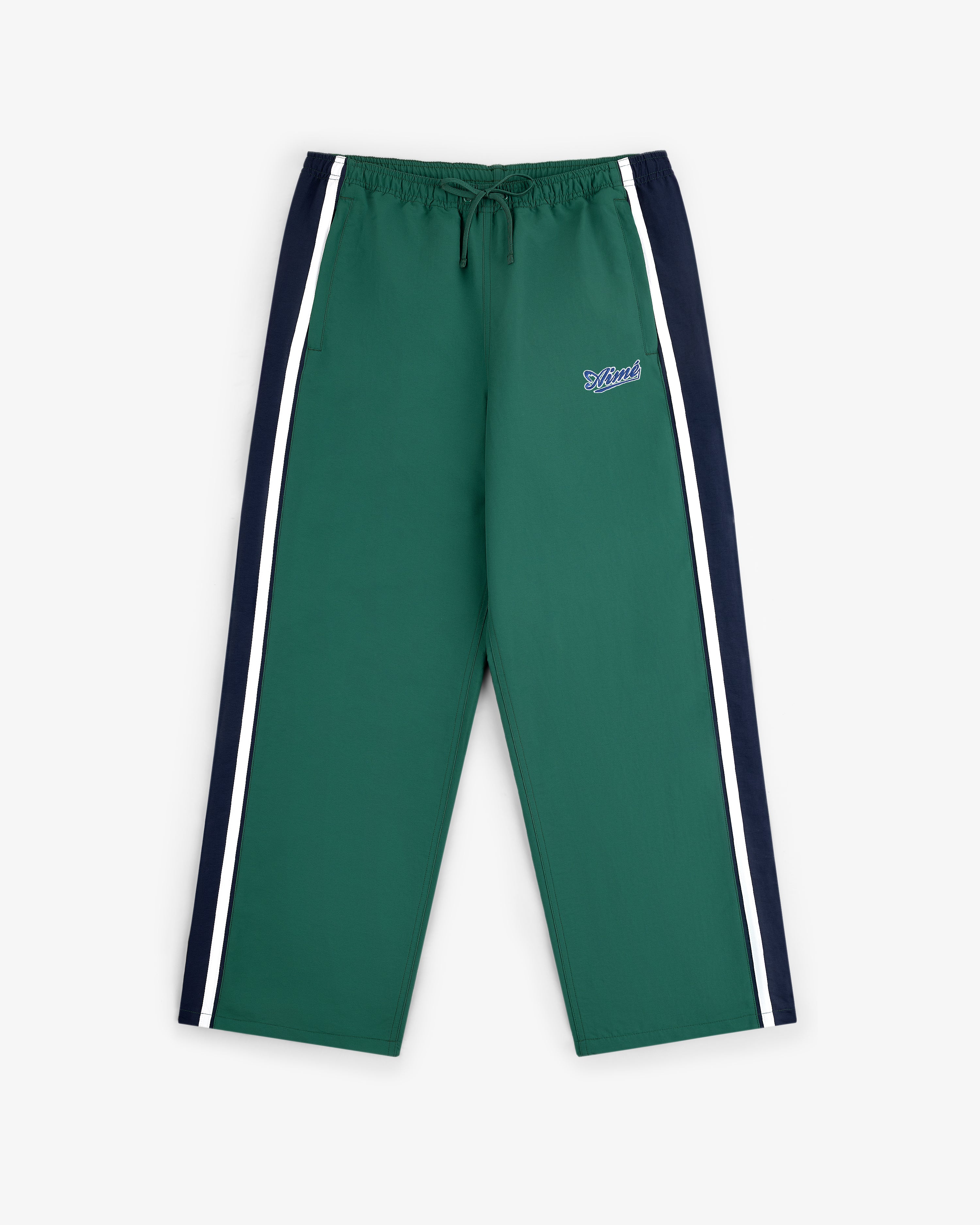 Colorblock Track Pant featuring navy side panels, white stripes, and a small embroidered logo on the left thigh.