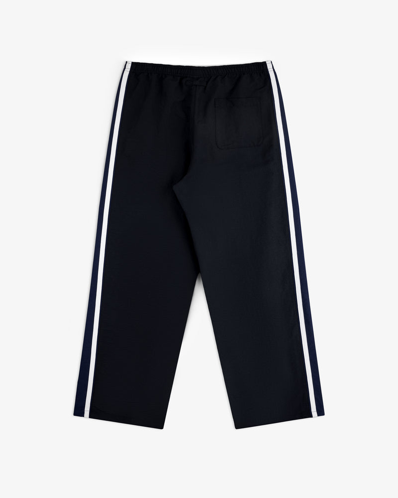 Colorblock Track Pant with white side stripes and single back pocket, flat on a white background.