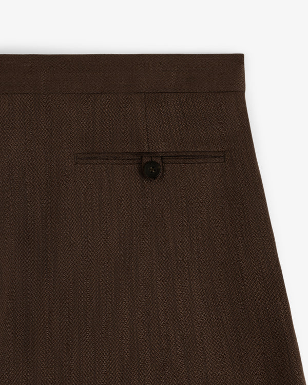 Close-up of the back pocket area of Linen Blend Suit Trouser in brown with a single button closure.