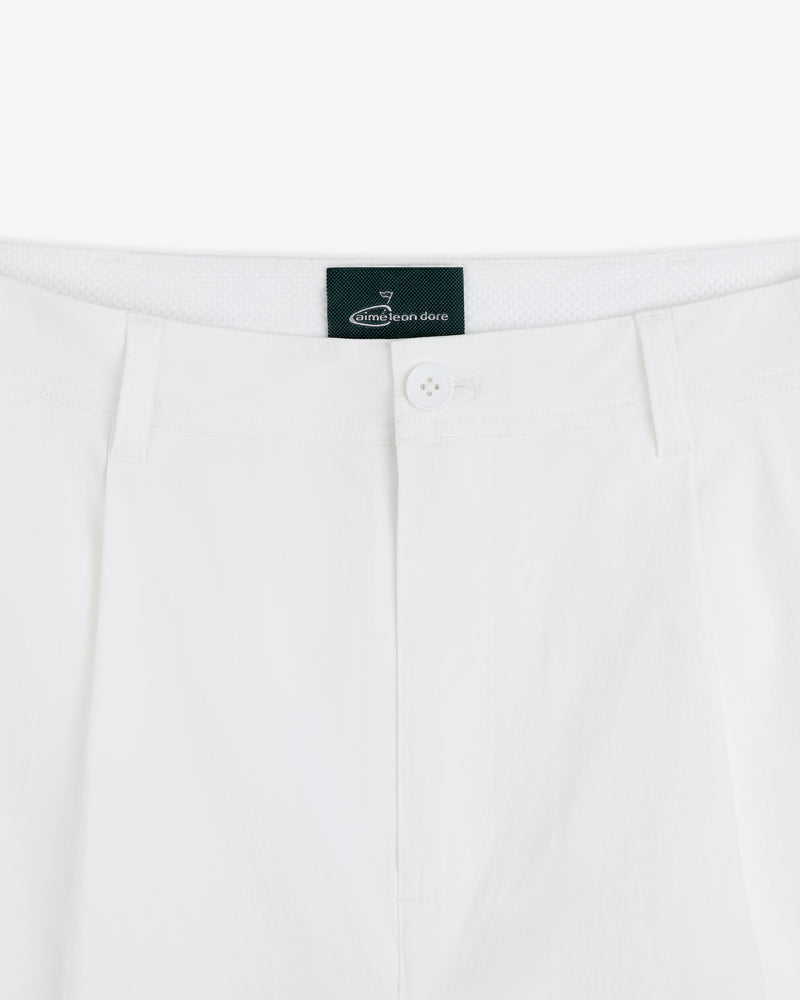 Close-up of the waistband and button of white ALD Golf Cordura Double Pleated Pant with belt loops and brand label.