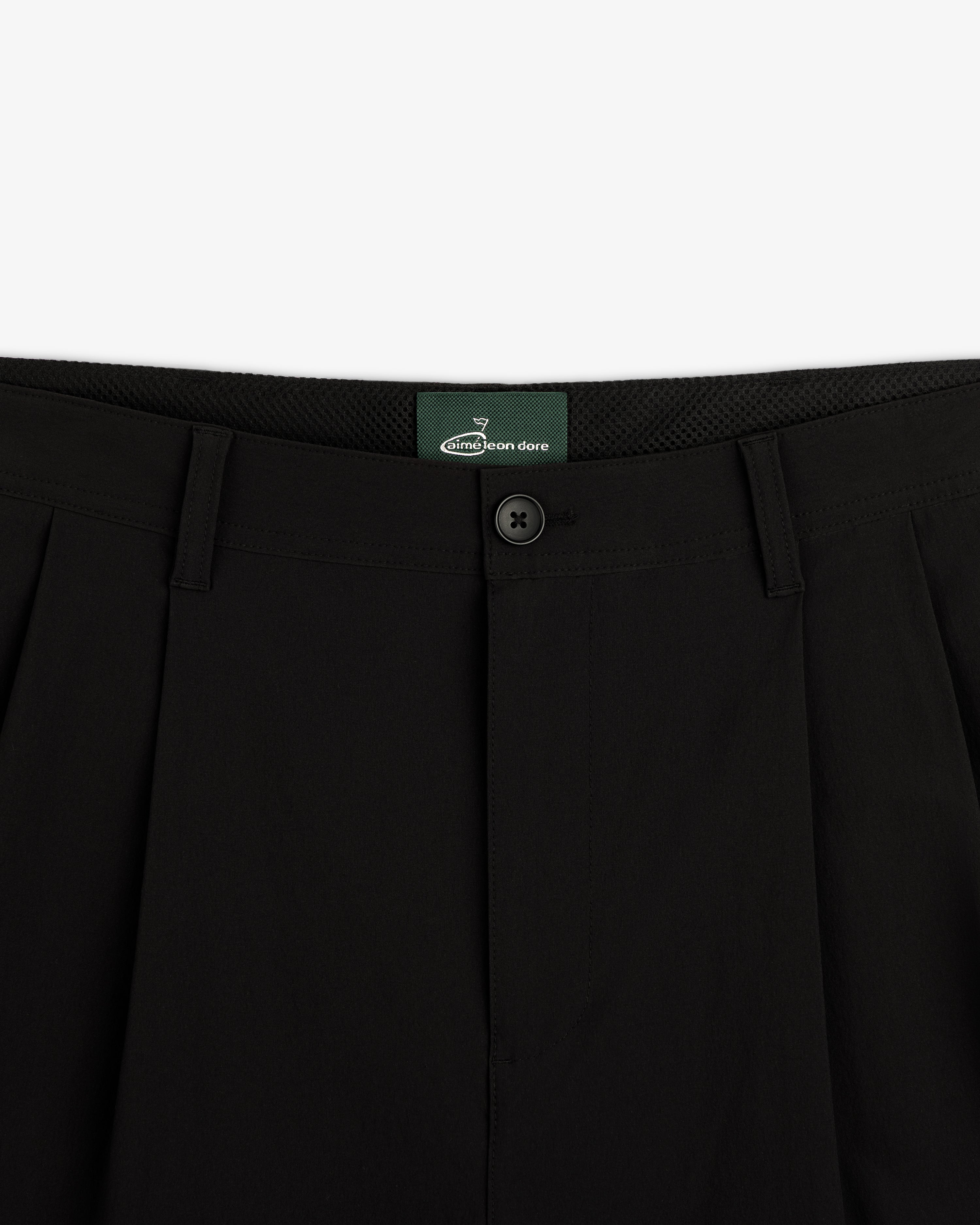 Close-up of the waistband and button on ALD Golf Cordura Double Pleated Pant in black, shown against a white background.