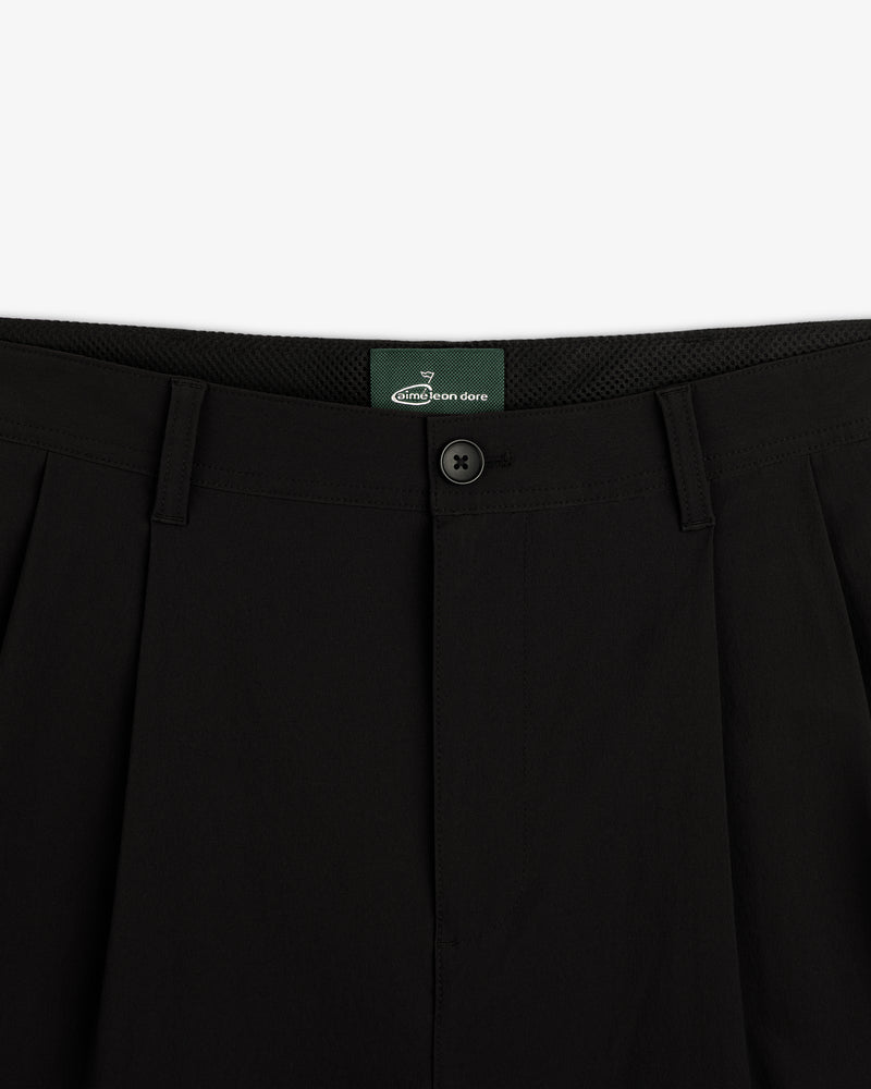 Close-up of the waistband and button on ALD Golf Cordura Double Pleated Pant in black, shown against a white background.