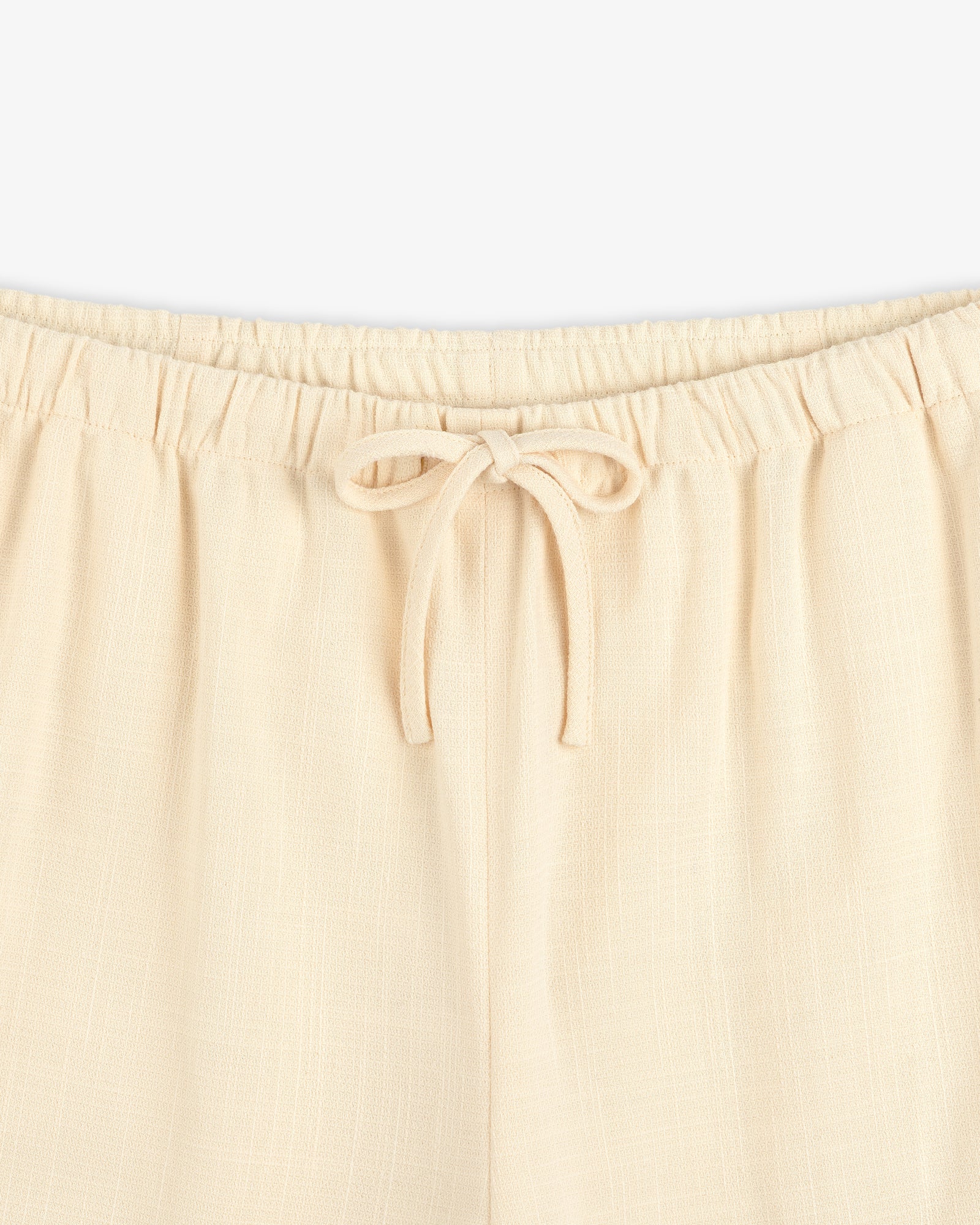 Drawstring Cotton Blend Suit Trouser in beige, featuring an elastic waistband; waist to upper thigh shown on white background.