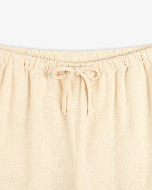 Drawstring Cotton Blend Suit Trouser in beige, featuring an elastic waistband; waist to upper thigh shown on white background.