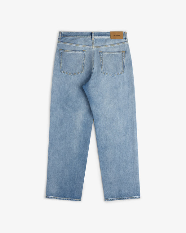 Relaxed Fit 5-Pocket Denim Pant in light blue, shown from the back with two pockets and a brown leather patch.