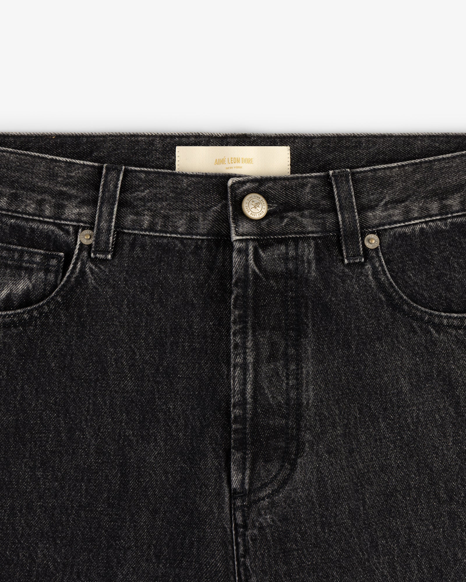 Close-up of the waistband and front of the Relaxed Fit 5-Pocket Denim Pant with button closure and belt loops.