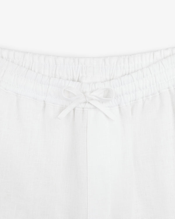 Close-up of Linen Leisure Pant in white with an elastic waistband and a front drawstring tied in a bow.