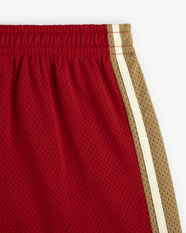 Close-up of Colorblock Court Short in red mesh with tan and white side stripes on a white background.