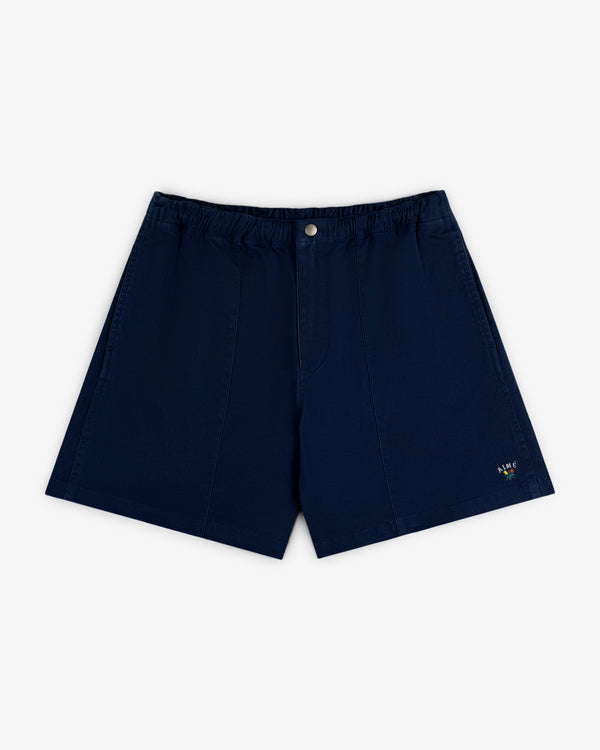 Crest Casual Short in navy blue with elastic waistband and a small colorful embroidered logo near the left hem.