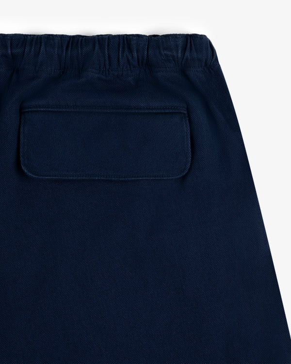 Close-up of Crest Casual Short in navy blue with an elastic waistband and a back flap pocket.