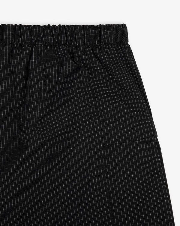 Close-up of Ripstop Nylon Wave Short in black with elastic waistband and white grid pattern.