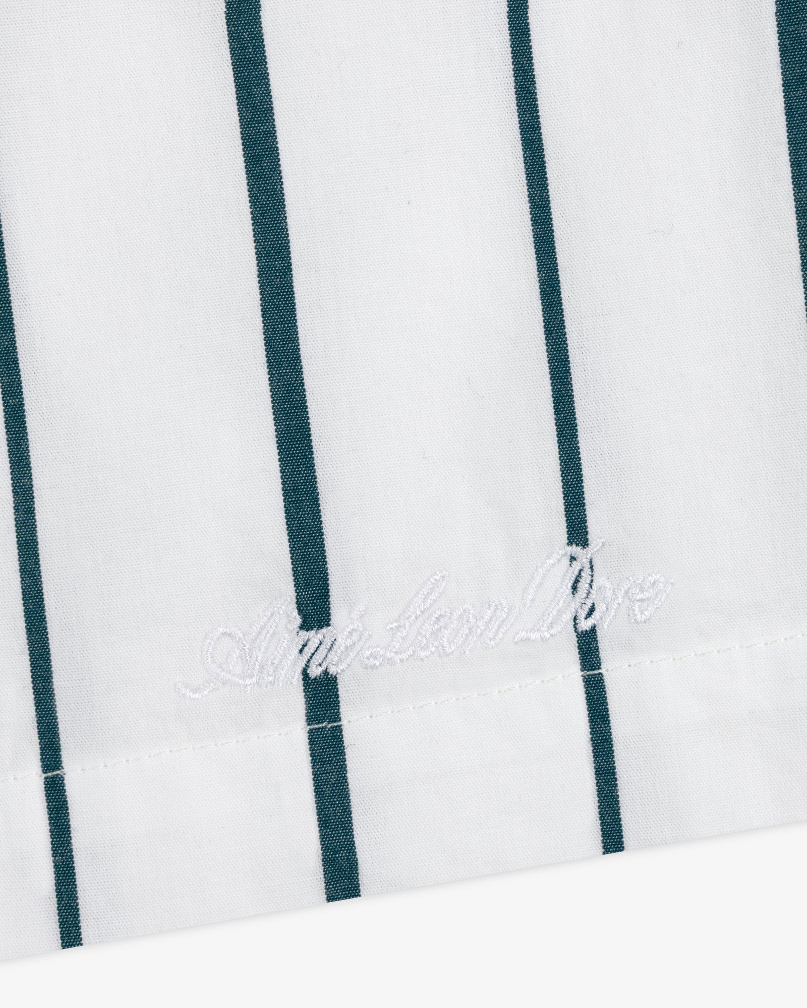 Striped Poplin Leisure Short: white fabric with vertical green stripes, American Polo logo embroidered near the hem.
