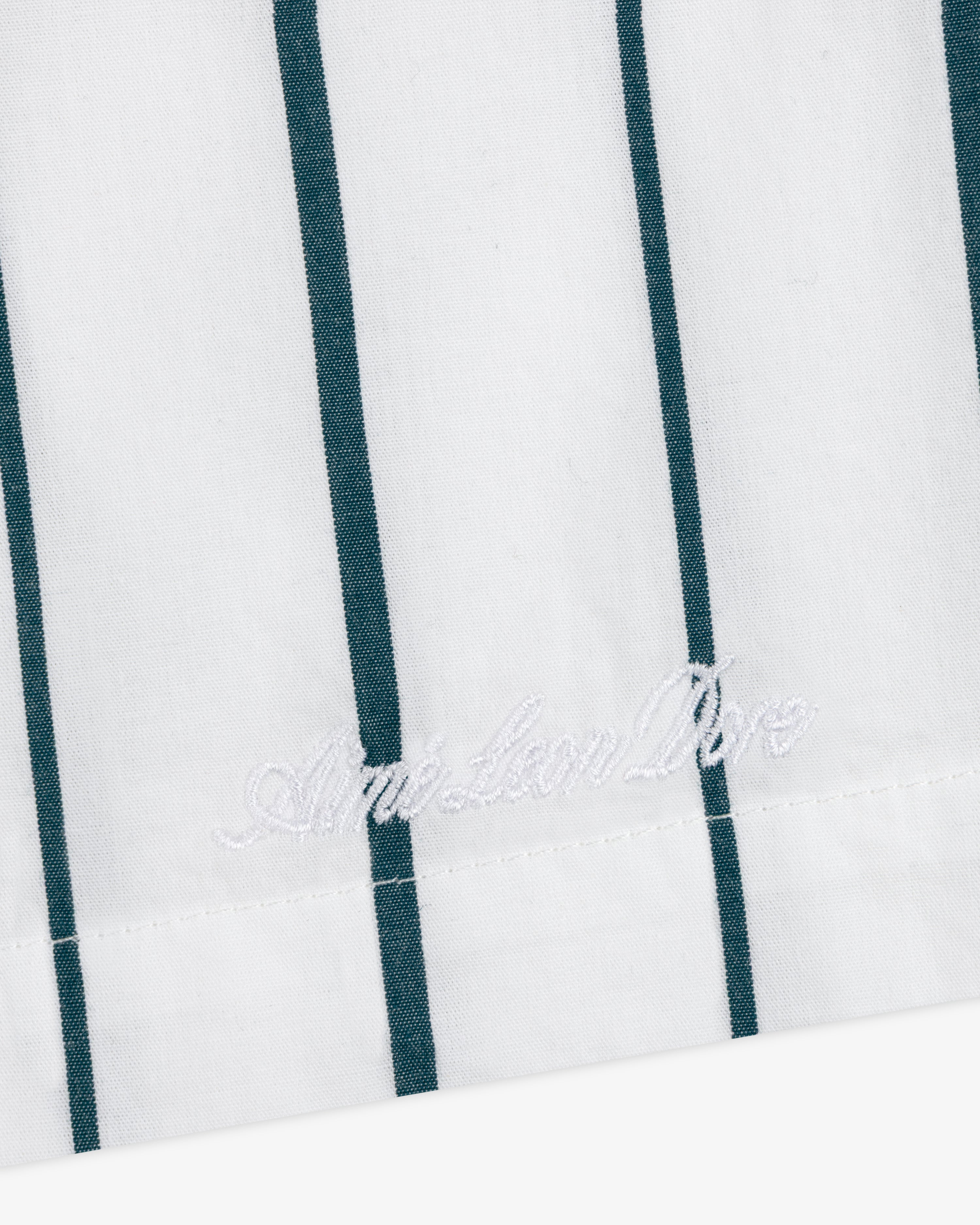 Striped Poplin Leisure Short: white fabric with vertical green stripes, American Polo logo embroidered near the hem.