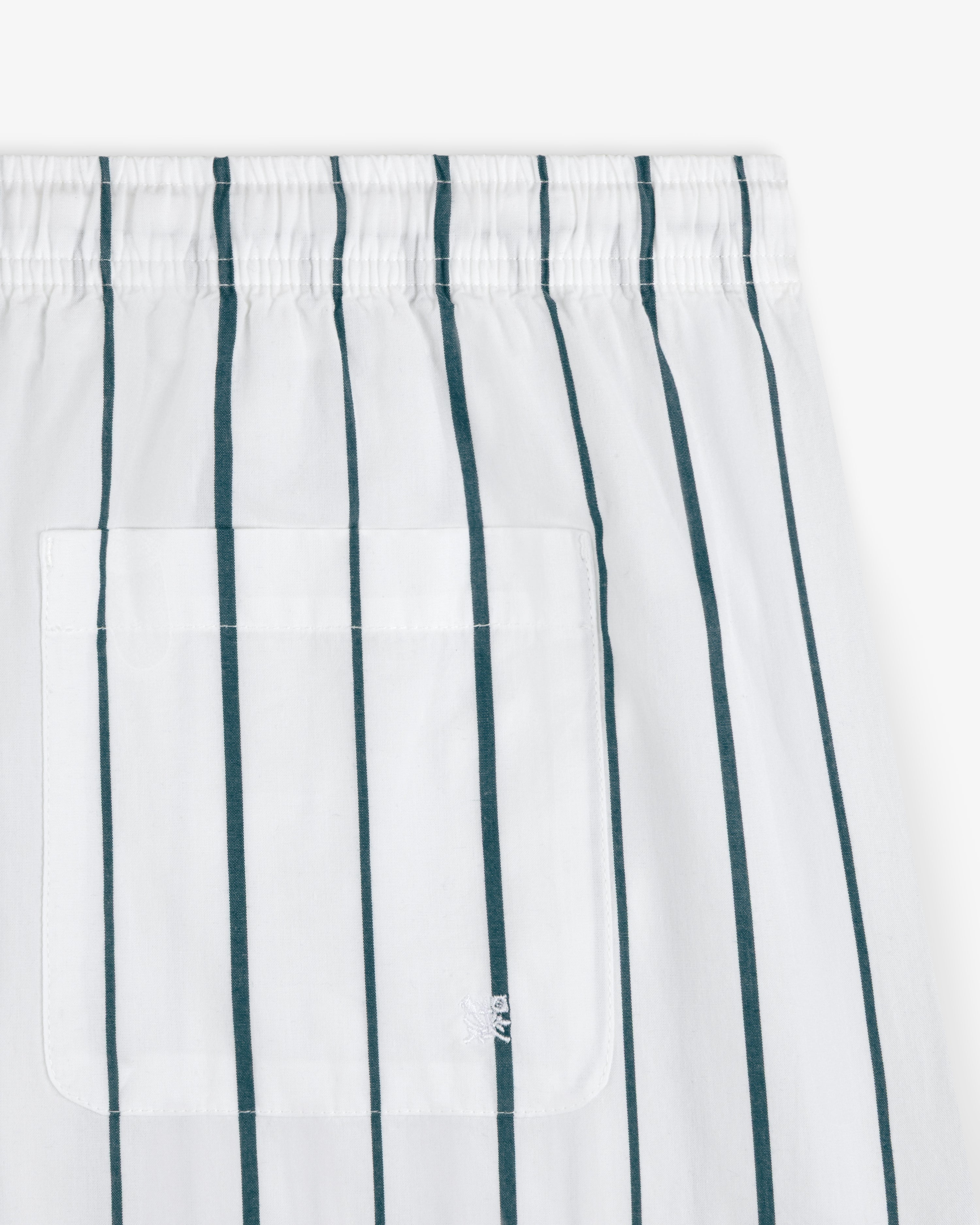 Striped Poplin Leisure Short: white fabric with vertical green stripes, square stitched pocket, and elastic waistband.