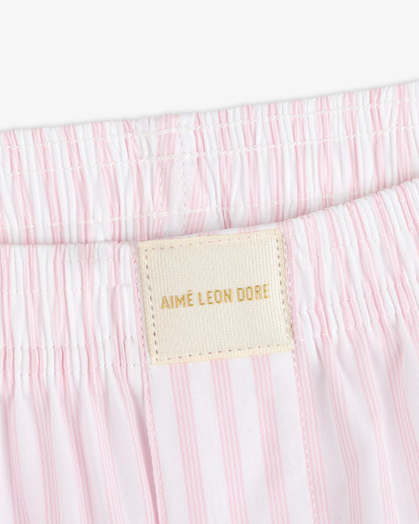 Close-up of Striped Boxer Short featuring pink and white stripes and an AIMÉ LEON DORE label on the waistband.
