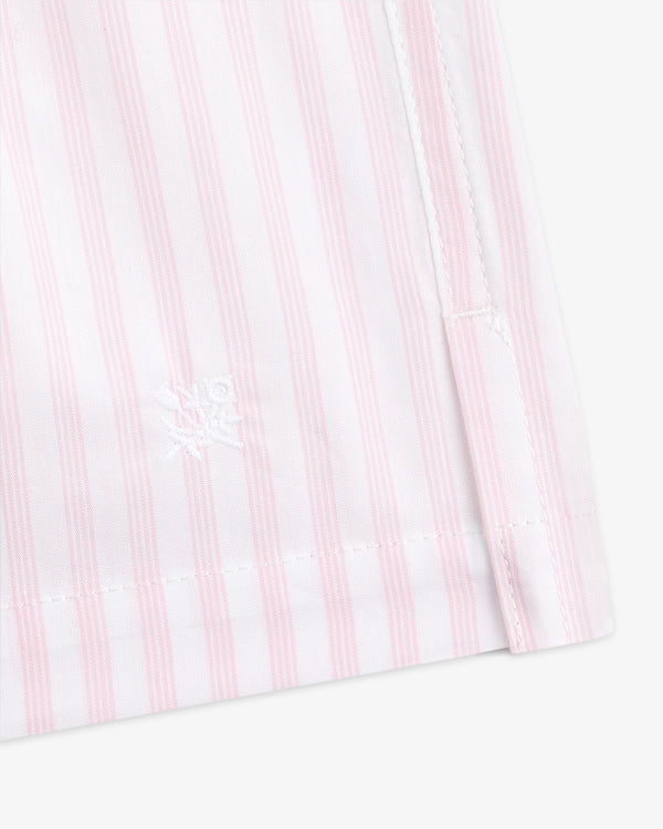 Close-up of Striped Boxer Short featuring pink and white vertical stripes and a white embroidered logo near the hem.