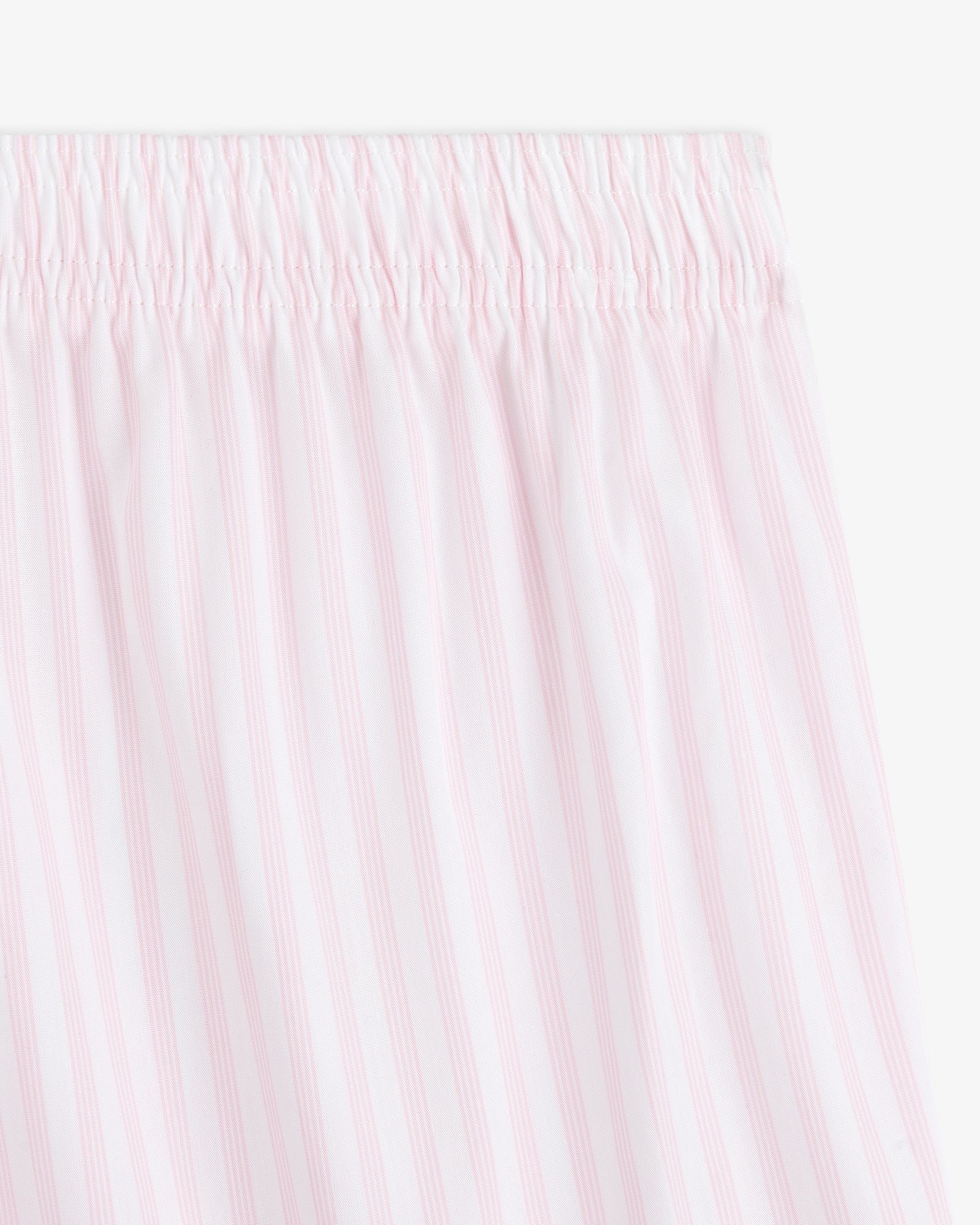 Close-up of Striped Boxer Short featuring white fabric with light pink vertical stripes and an elastic waistband.
