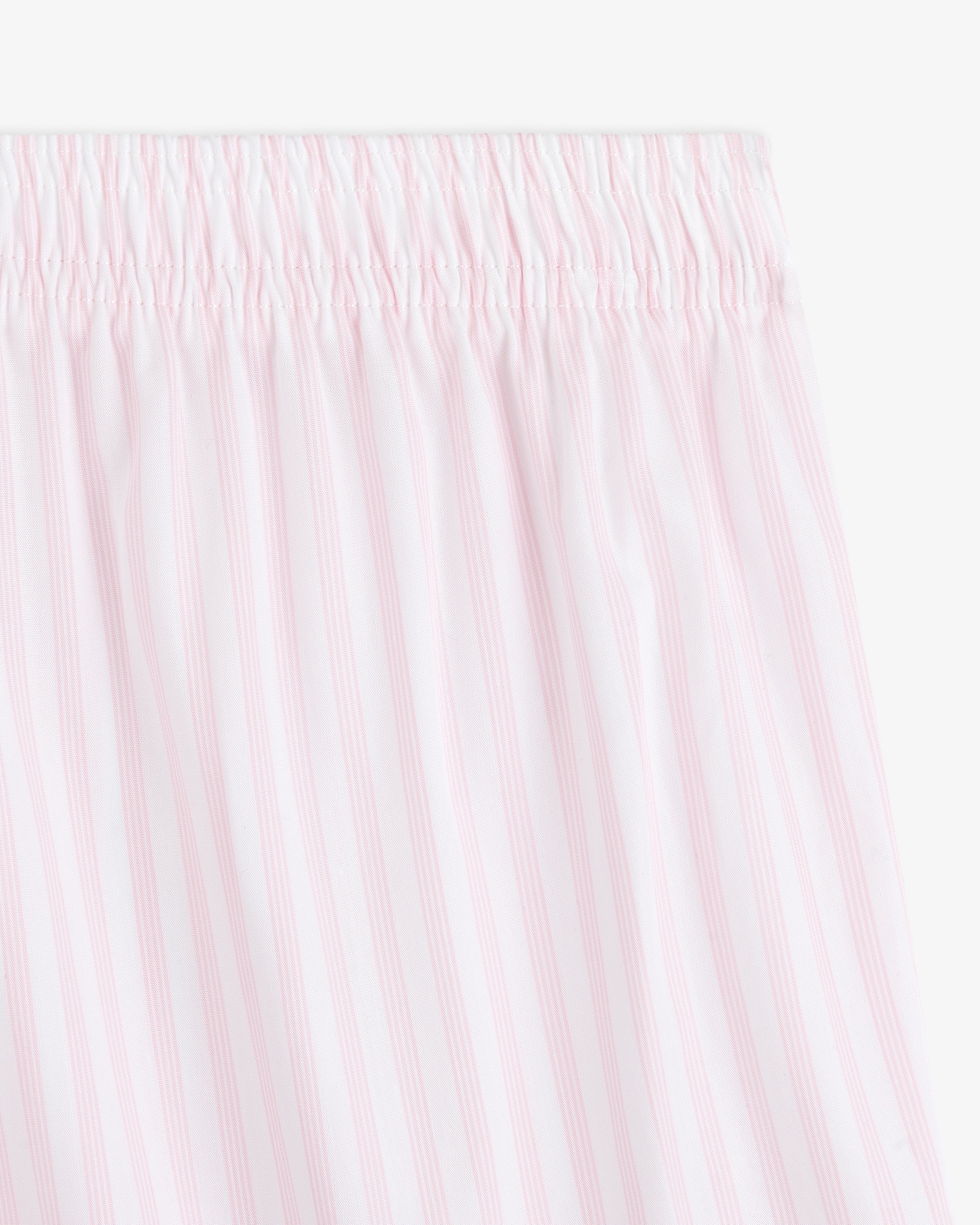 Close-up of Striped Boxer Short featuring white fabric with light pink vertical stripes and an elastic waistband.