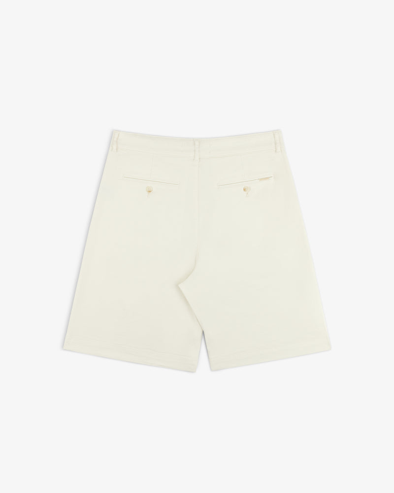 Back view of Pleated Linen Blend Bermuda Short in cream with two back pockets and buttons, shown on white background.