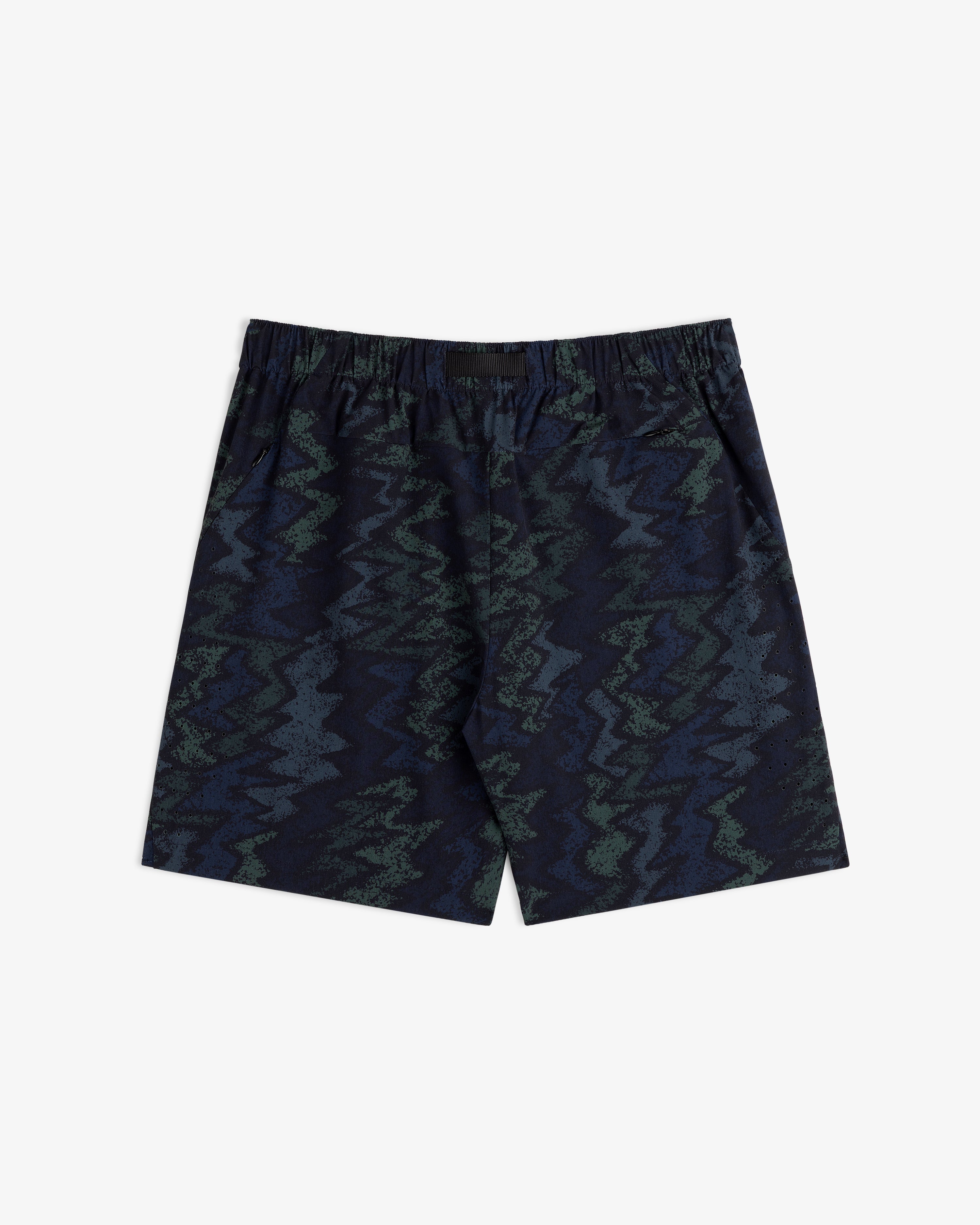 ALD Golf Performance Short in navy blue with a green and blue zigzag abstract pattern on a white background.