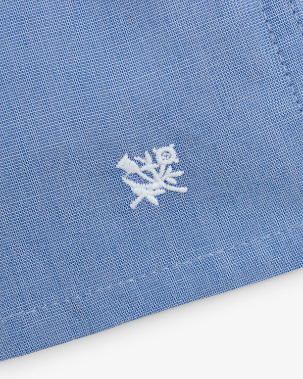 Close-up of blue Boxer Short 2-Pack with a small white embroidered flower and leaf near the edge.