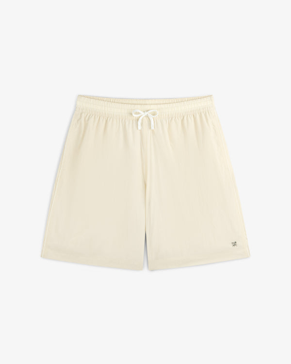 Long Nylon Track Short in off-white with drawstring and elastic waistband, shown flat on a white background.