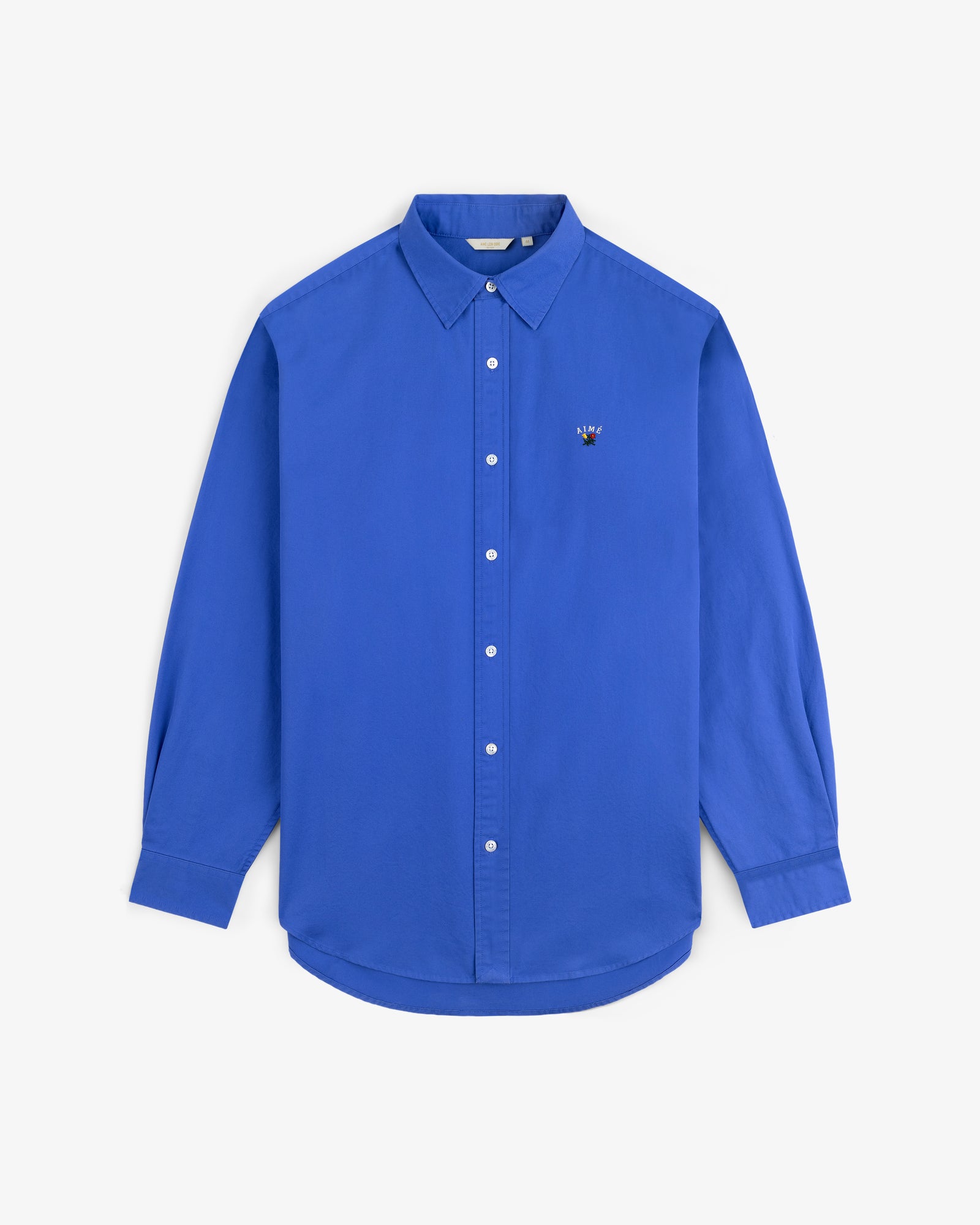 The Leon Overshirt is a royal blue, long-sleeve button-up with a small embroidered chest logo.