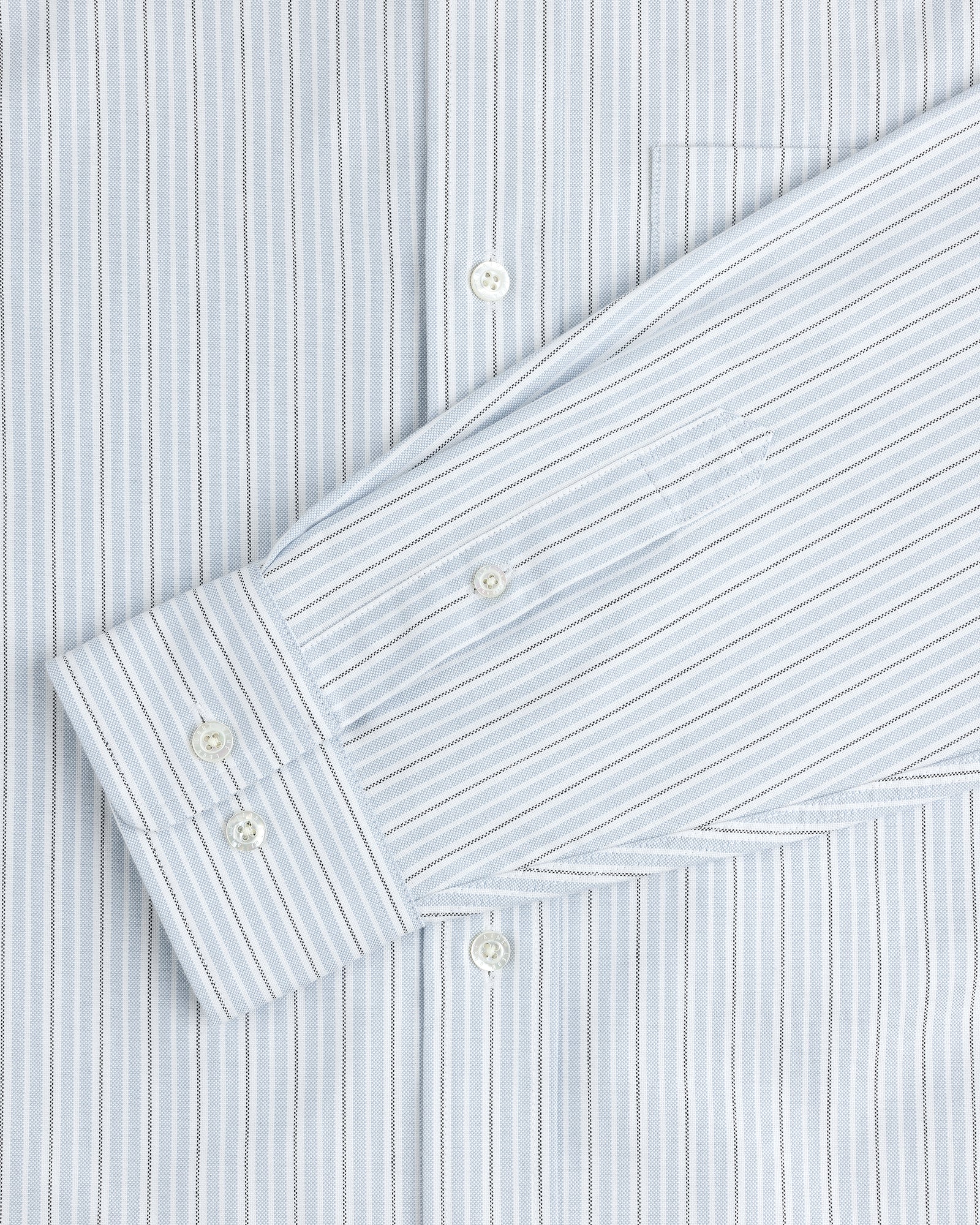 Yarn Dyed Striped Crest Shirt in light blue and white with visible buttons and a chest pocket.