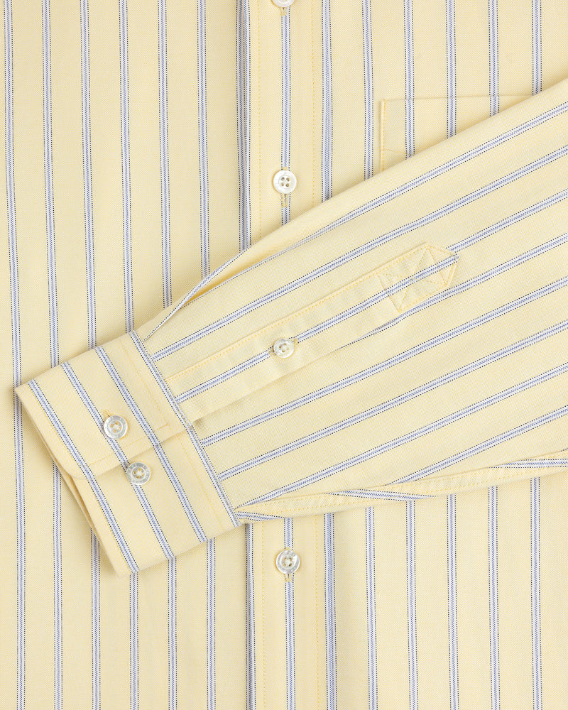 Yarn Dyed Striped Crest Shirt in yellow with blue stripes, close-up of sleeve, buttons, and pocket.