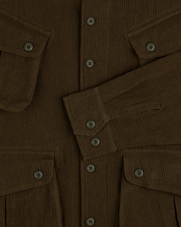 Mesh Jungle Shirt with buttoned front, flap pockets, and long sleeves overlapping at the center.