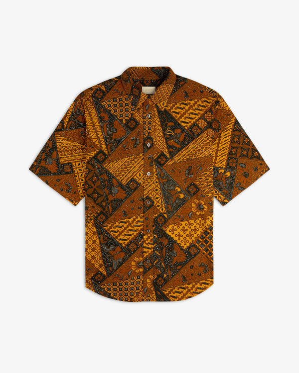 Printed Abstract Shirt featuring short sleeves and a brown, black, and orange geometric-floral batik pattern.